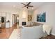 Bright living room featuring hardwood floors, a ceiling fan, and a cozy seating area at 422 Laurel Spring Ct, Canton, GA 30114