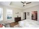 Bright main bedroom with tray ceilings, ceiling fan and neutral paint at 422 Laurel Spring Ct, Canton, GA 30114