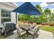 Outdoor patio featuring a dining table, six chairs, and a grill at 422 Laurel Spring Ct, Canton, GA 30114