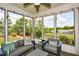 Cozy sunroom with comfortable seating, a ceiling fan, and bright, natural light at 422 Laurel Spring Ct, Canton, GA 30114
