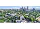 An aerial view of the apartment complex surrounded by lush greenery with the city skyline at 525 Parkway Ne Dr # 110, Atlanta, GA 30354