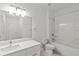 Bright bathroom featuring a single vanity with a modern countertop and a shower/tub combo at 525 Parkway Ne Dr # 110, Atlanta, GA 30354