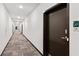 Long hallway with modern carpet and multiple doors, leading to various units at 525 Parkway Ne Dr # 110, Atlanta, GA 30354