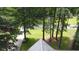 Aerial view of property showcasing landscaping and neighborhood view with mature trees and green lawn at 5307 Red Rock Trce, Powder Springs, GA 30127