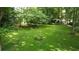 Expansive backyard surrounded by lush greenery, offering a private and serene outdoor space at 5307 Red Rock Trce, Powder Springs, GA 30127