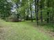 Large backyard with trees at 5307 Red Rock Trce, Powder Springs, GA 30127