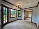 Bright dining room featuring wood-look floors, trim, and a door to the outside at 5307 Red Rock Trce, Powder Springs, GA 30127