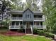 Charming home with double porches, and manicured front yard at 5307 Red Rock Trce, Powder Springs, GA 30127