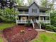 Charming two-story home with double balconies and beautiful yard at 5307 Red Rock Trce, Powder Springs, GA 30127