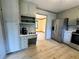 Open kitchen with stainless steel appliances, light gray cabinets, and built in desk area at 5307 Red Rock Trce, Powder Springs, GA 30127