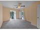 Bedroom with a ceiling fan, carpet and a sliding glass door with backyard access at 1312 Pine Heights Ne Dr, Atlanta, GA 30324