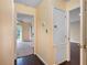 Inviting hallway with hardwood floors leading to multiple rooms with neutral-colored walls at 1312 Pine Heights Ne Dr, Atlanta, GA 30324