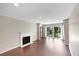 Bright living room features a fireplace and sliding glass doors to a private balcony with scenic outdoor views at 1312 Pine Heights Ne Dr, Atlanta, GA 30324