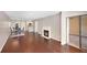 Spacious living area with hardwood floors, fireplace, and access to the dining room and kitchen at 1312 Pine Heights Ne Dr, Atlanta, GA 30324
