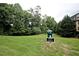 Designated pet area with green grass and a pet waste station at 1312 Pine Heights Ne Dr, Atlanta, GA 30324