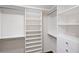 Walk-in closet with custom shelving and drawers for optimal organization and storage at 1312 Pine Heights Ne Dr, Atlanta, GA 30324