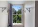 Bright window with decorative shelving offering scenic views of lush greenery at 1312 Pine Heights Ne Dr, Atlanta, GA 30324
