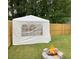 Backyard area featuring a fire pit with stone surround and a white party tent at 1754 Soapstone Ct, Decatur, GA 30034