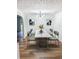 Bright dining room with modern lighting, stylish table, and elegant chairs at 1754 Soapstone Ct, Decatur, GA 30034