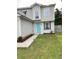 Well-maintained home with neat landscaping and a bright turquoise front door at 1754 Soapstone Ct, Decatur, GA 30034