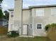 Rear exterior view of home showing the siding, fencing, and access to backyard at 1754 Soapstone Ct, Decatur, GA 30034