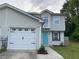 Charming townhome with a one car garage and a bright, inviting turquoise front door at 1754 Soapstone Ct, Decatur, GA 30034
