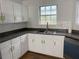 Well-lit kitchen with modern cabinets, counter space, and sleek hardware at 1754 Soapstone Ct, Decatur, GA 30034