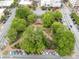 High aerial shot of a well-maintained park square featuring lush trees and tidy walking paths at 281 Cherokee Ne St, Marietta, GA 30060