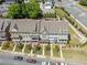 Aerial view of newly constructed townhomes with manicured lawns and street parking at 281 Cherokee Ne St, Marietta, GA 30060