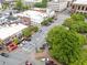 Aerial view of the park square, highlighting its mature trees, and its surroundings in the city at 281 Cherokee Ne St, Marietta, GA 30060