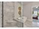 Bathroom featuring glass shower and soaking tub with neutral tones, accented by a bedroom view at 281 Cherokee Ne St, Marietta, GA 30060