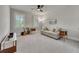 Bright and airy bedroom with neutral carpet, plantation shutters, and a ceiling fan at 281 Cherokee Ne St, Marietta, GA 30060