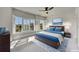 Bright bedroom with a large bed, blue accents, and sunlit windows with white plantation shutters at 281 Cherokee Ne St, Marietta, GA 30060