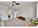 Spacious bedroom featuring a ceiling fan, neutral carpet, and easy access to the bathroom at 281 Cherokee Ne St, Marietta, GA 30060