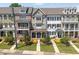 Attractive townhome community featuring diverse facades, manicured landscaping, and inviting walkways at 281 Cherokee Ne St, Marietta, GA 30060