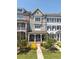 Inviting townhome exterior with a covered porch and fresh landscaping, offering great curb appeal at 281 Cherokee Ne St, Marietta, GA 30060