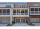 Townhome exterior with screened porches above attached garages and well-maintained landscaping at 281 Cherokee Ne St, Marietta, GA 30060
