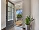 Warm entryway featuring a dark wood door, hardwood floors, and a view of the outdoor porch at 281 Cherokee Ne St, Marietta, GA 30060