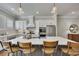 Spacious kitchen with white cabinetry, large island, stainless appliances, and stylish pendant lighting at 281 Cherokee Ne St, Marietta, GA 30060