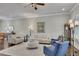 Bright living room featuring hardwood floors, ceiling fan, neutral paint, and comfortable seating arrangement at 281 Cherokee Ne St, Marietta, GA 30060