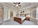 Comfortable main bedroom with a bed and an adjoining bathroom at 281 Cherokee Ne St, Marietta, GA 30060