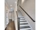 Elegant staircase with dark wood railings and trim, complemented by neutral wall colors at 281 Cherokee Ne St, Marietta, GA 30060