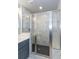 Modern bathroom features a glass-enclosed shower with marble tile and a gray-toned vanity at 3352 Landings South Dr, Atlanta, GA 30331
