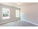 Cozy bedroom filled with natural light from two large windows and neutral carpet at 3352 Landings South Dr, Atlanta, GA 30331