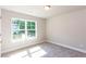 Bright bedroom with large window view, neutral carpet and white baseboards, offering a peaceful retreat at 3352 Landings South Dr, Atlanta, GA 30331