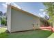 View of the home's exterior showing its siding, small backyard, door, and window at 3352 Landings South Dr, Atlanta, GA 30331