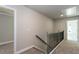 Second story hallway with neutral colored walls and floors at 3352 Landings South Dr, Atlanta, GA 30331
