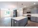 Modern kitchen with stainless appliances, large island, and an open floor plan at 3352 Landings South Dr, Atlanta, GA 30331