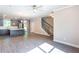 Spacious living room with ceiling fan, hardwood flooring, and a staircase leading to the upper level at 3352 Landings South Dr, Atlanta, GA 30331
