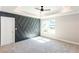 Main bedroom with tray ceilings, decorative wall, fan, and lots of natural light at 3352 Landings South Dr, Atlanta, GA 30331